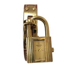 画像をギャラリービューアに読み込む, HERMES エルメス ケリーウォッチ 腕時計 ゴールド ブラウン 〇U刻印 クオーツ ゴールド文字盤【中古】 レディース